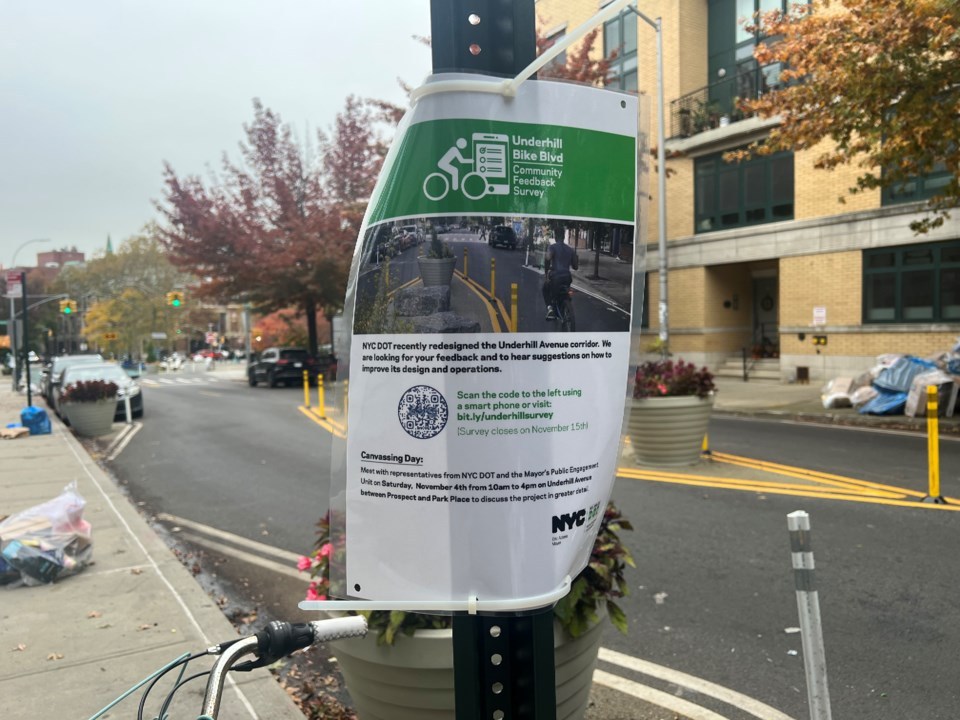 laminated sign attached to a street post for feedback on street design