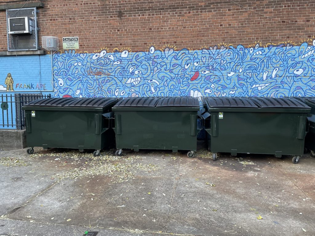 3 small rolling trash dumpsters used by PS 9